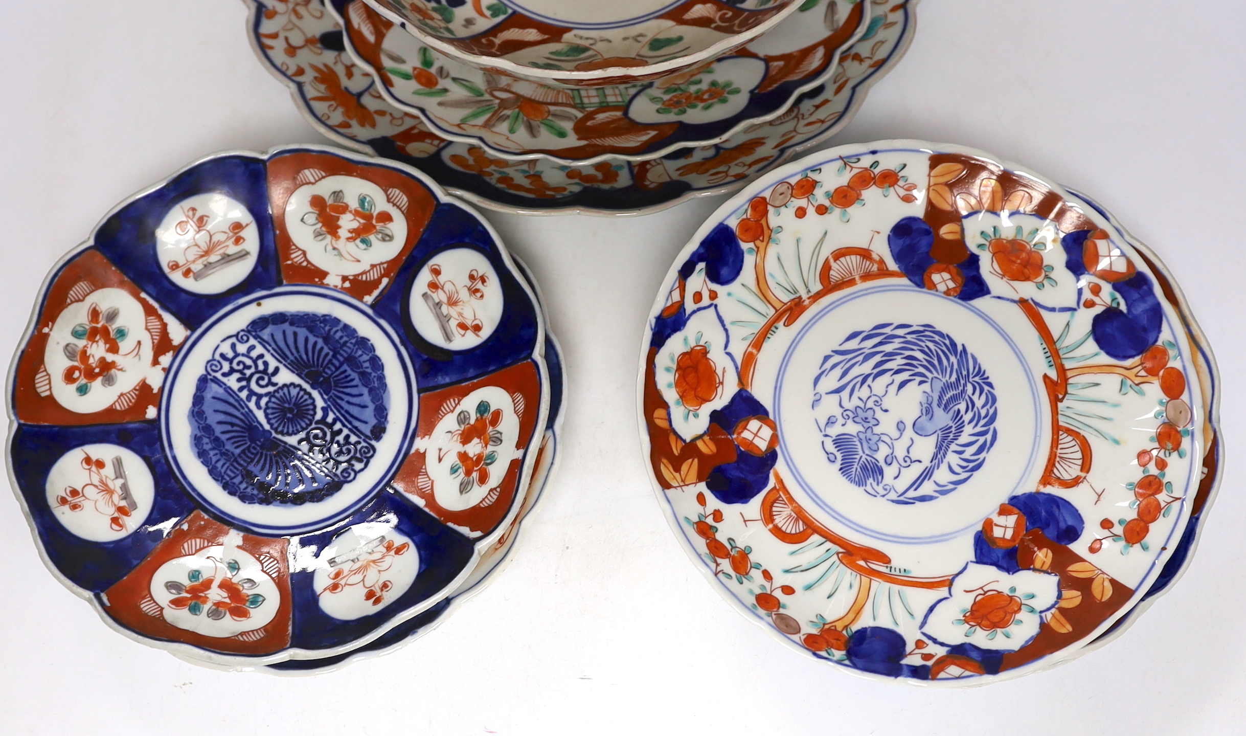 A group of Japanese Imari plates, dishes, a bowl and a vase